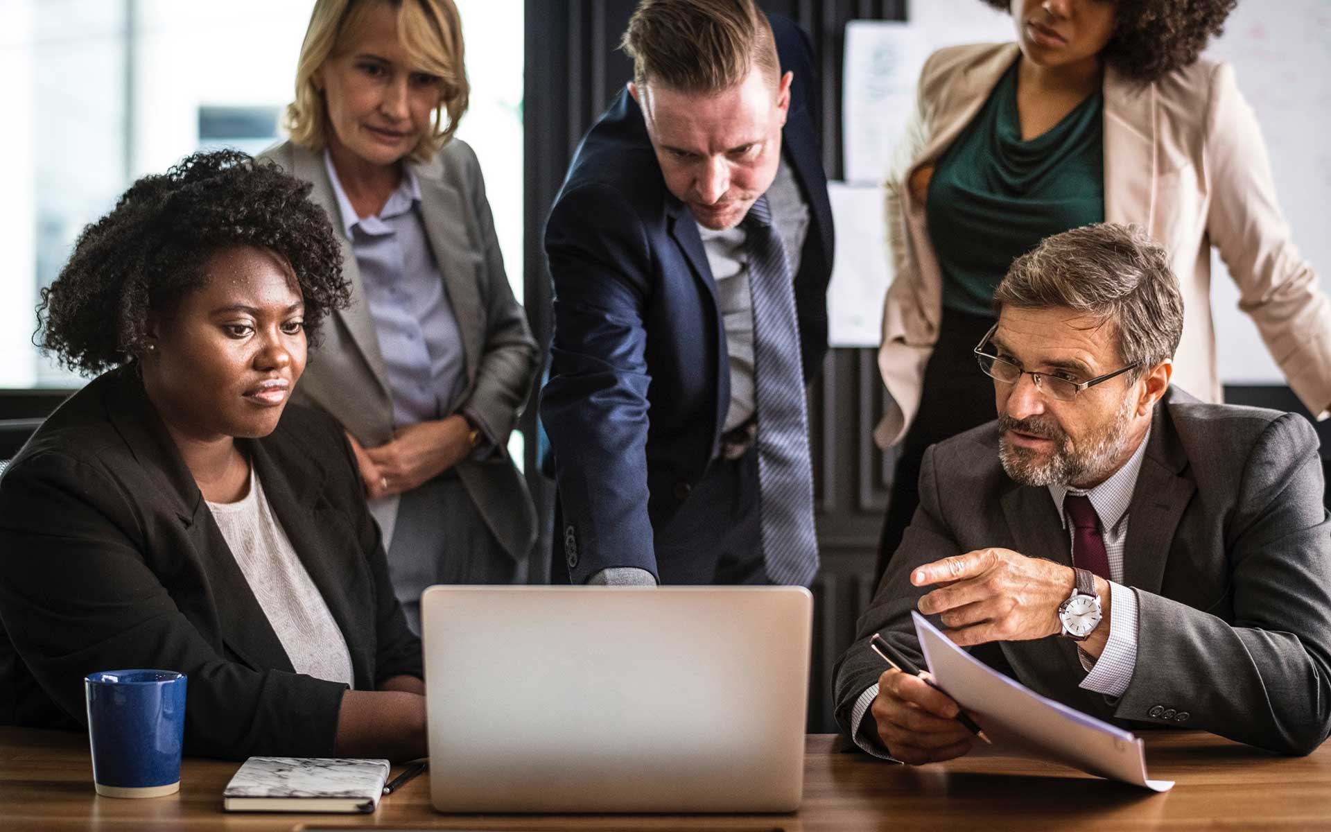 Diverse business professionals collaborating around a conference table
